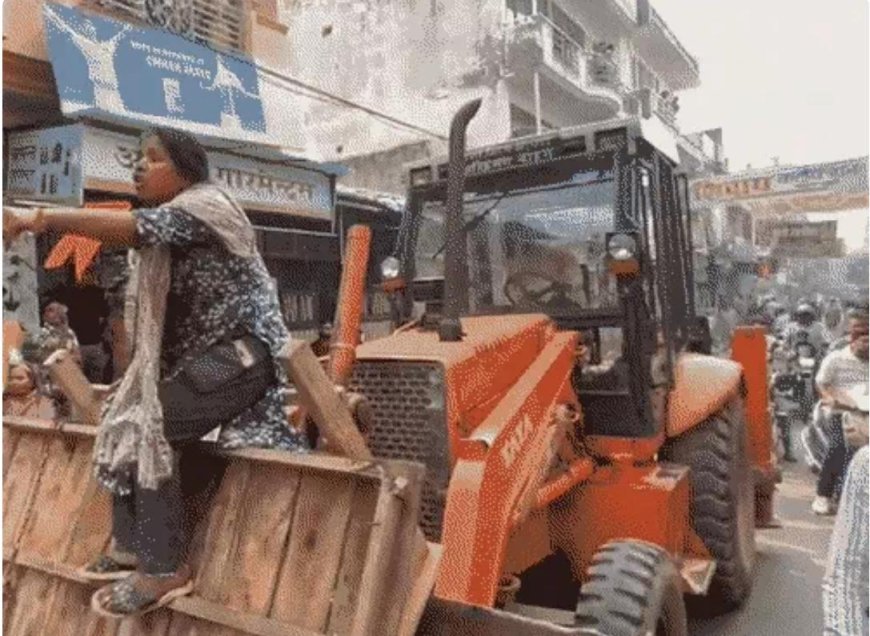 ट्रांस यमुना में चला निगम का बुलडोजर, महिला जेसीबी पर चढ़ी, बाजार में मचा हंगामा